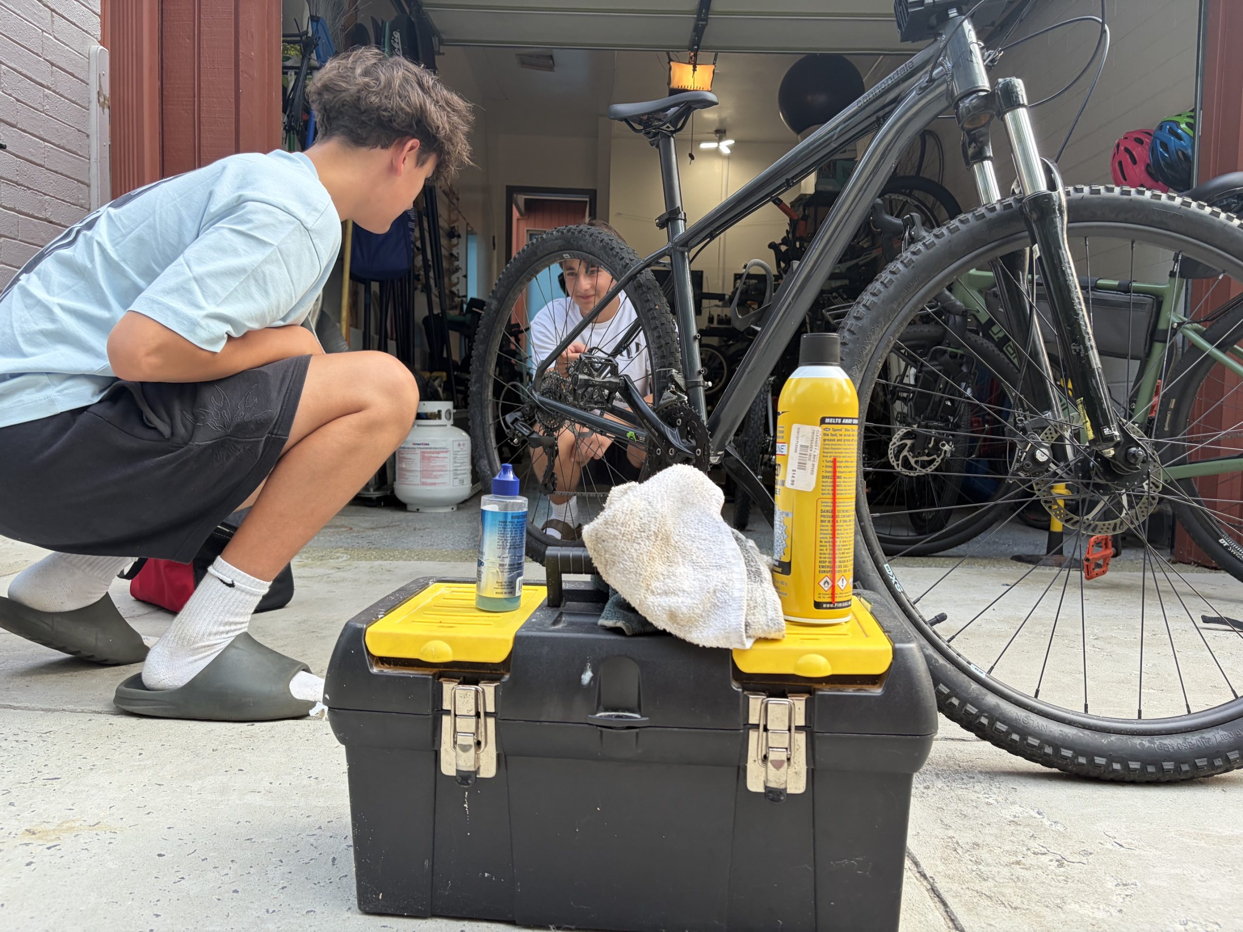 A Success Cycles founder fixing up a donated bike