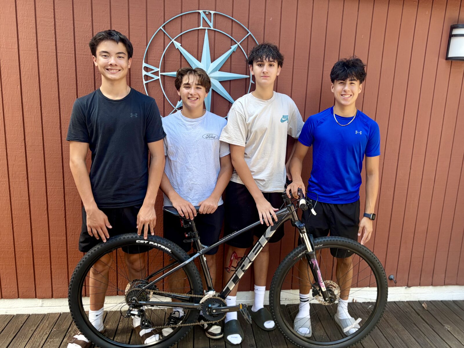 The Success Cycles team with a refurbished bike ready for its next rider